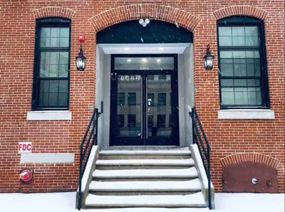 a door to a building with stairs in front at 505 Relaxing 1BR apartment in center city of Philly in Philadelphia