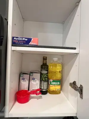 a cabinet with medicines and other items in it at 505 Relaxing 1BR apartment in center city of Philly in Philadelphia