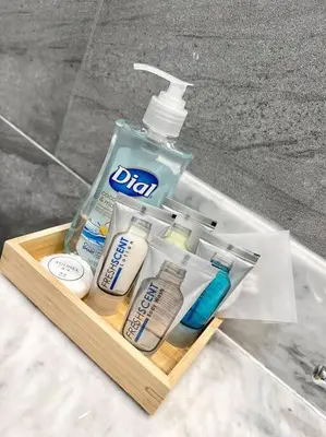 a container of toothbrushes and a bottle of toothpaste at 508 Urban Lifestyle king bed APT in Center CITY in Philadelphia