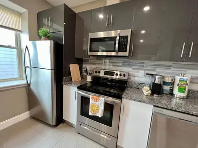 a kitchen with a stainless steel stove and a microwave at 501 Cozy and Comfy 1BR apartment in center city in Philadelphia