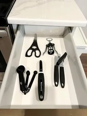 a white shelf with scissors and other kitchen utensils at 302 Comfy Cabin 1BD with city view in Center city in Philadelphia