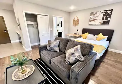 a living room with a couch and a bed at 303 Cozy and modern 1BR apartment in center City in Philadelphia