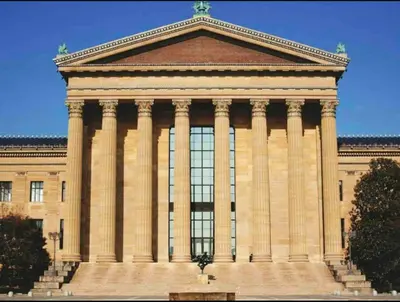 a large building with columns on top of it at 305 Cozy and lovely 1BDR apartment in Center City in Philadelphia