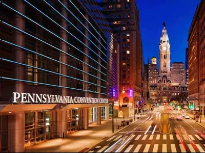 a city street at night with a clock tower at 308 Cozy and warm King Bed APT in center city in Philadelphia