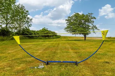 a volleyball net in the middle of a field at Unique Stay! Ricketts Chic Farmhouse Retreat with Stargazing Bubble Tent in Stillwater