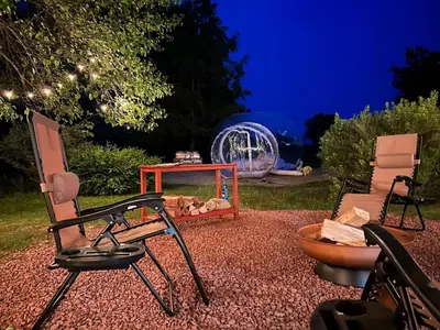 a group of chairs and a table and a table at Unique Stay! Ricketts Chic Farmhouse Retreat with Stargazing Bubble Tent in Stillwater