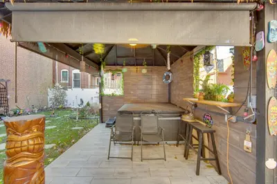 a patio with a table and chairs under a tent at Less Than 2 Mi to Downtown and Capitol Harrisburg Hideaway in Harrisburg