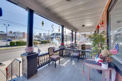 a porch of a store with chairs and a table at Less Than 2 Mi to Downtown and Capitol Harrisburg Hideaway in Harrisburg