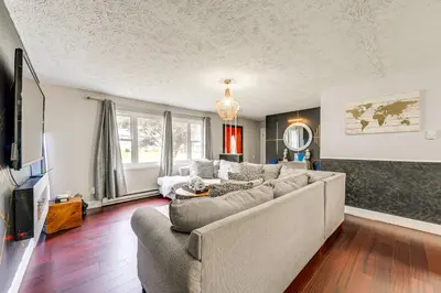 a living room with a couch and a tv at A Time to Remember Home in Tobyhanna with Pool! in Tobyhanna