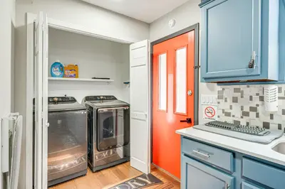 a kitchen with a stove and a washer and dryer at A Time to Remember Home in Tobyhanna with Pool! in Tobyhanna