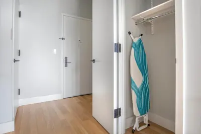 a closet with a blue and white umbrella in a room at East Village 2br w doorman wd nr Union Square NYC-1185 in New York