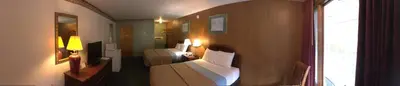 a hotel room with two beds and a window at Mahoning Inn in Lehighton