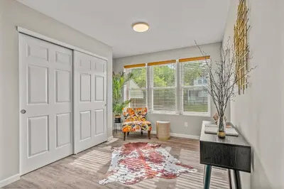 a living room with a door and a chair at Uptown Gem! Immaculate-Comfort-Character! in Philadelphia
