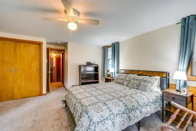a bedroom with a bed and a ceiling fan at 8 Mi to Elk Mountain Ski Resort Clifford Home! in Clifford