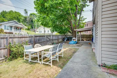 a backyard with a table and chairs and a fence at Pool Access Bath Vacation Rental Condo! in Hollo