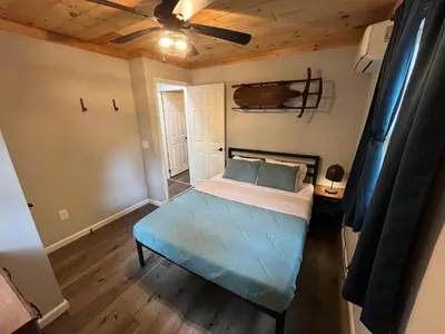 a small bedroom with a bed and a ceiling at Wally's House in Hawley