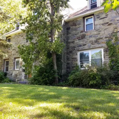 a stone house with a lawn in front of it at Fairmount House Free Street Parking Quiet Spacious in Philadelphia