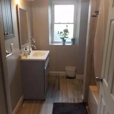 a bathroom with a sink and a window at Fairmount House Free Street Parking Quiet Spacious in Philadelphia