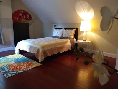 a bedroom with a bed with a lamp and a rug at Fairmount House Free Street Parking Quiet Spacious in Philadelphia