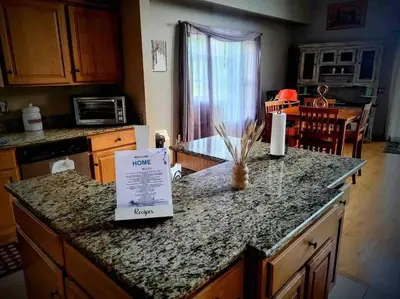 a kitchen counter top with a sign on it at Upstate getaway. Leave your troubles behind. in Unadilla