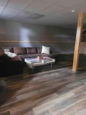 a living room with a couch and a table at Upstate getaway. Leave your troubles behind. in Unadilla