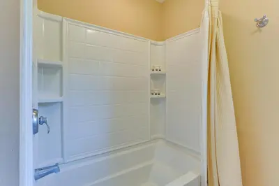 a bathroom with a tub and a shower stall at Warwick Vacation Rental with Private Yard and Fire Pit in Warwick