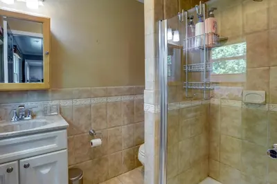 a bathroom with a shower and a sink at Charming Monroe Township Home - 13 Mi to RU! in East Brunswick