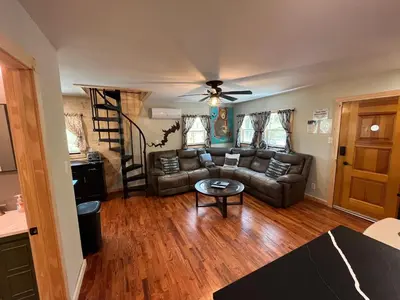 a living room with a couch and a table at Wally's Cabin in Hawley