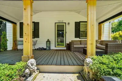 a front porch of a house with a wooden deck at 1255 Ashbridge, West Chester, PA in West Chester