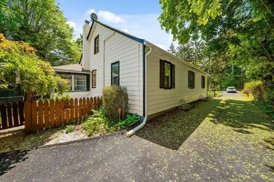 a small white house with a fence in a yard at 1255 Ashbridge, West Chester, PA in West Chester