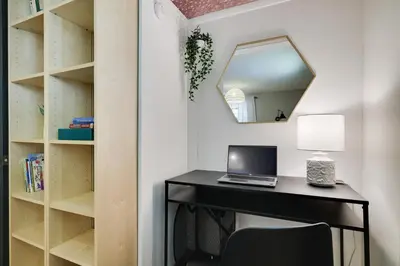 a desk with a laptop and a mirror at Family Pocono Gem by the lake with private sauna, hot tub, and huge game room in Arrowhead Lake