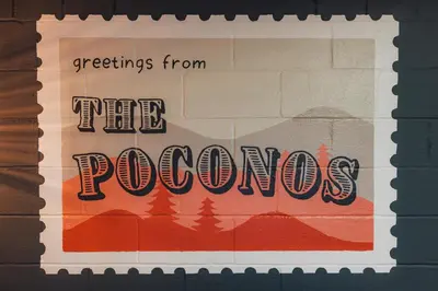 a sign that reads greetings from the poohos at Family Pocono Gem by the lake with private sauna, hot tub, and huge game room in Arrowhead Lake