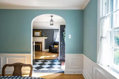 a room with a hallway with blue walls and a floor at Beautiful fully-furnished Colonial in Millersville in Millersville