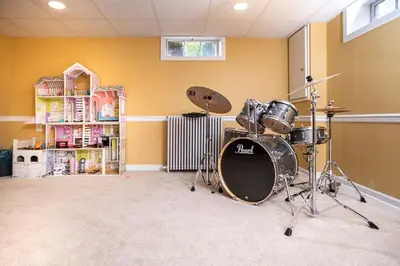 a room with a drum set in the corner of a room at Beautiful fully-furnished Colonial in Millersville in Millersville