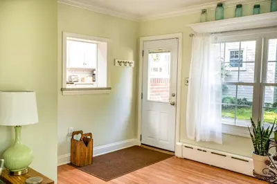 a living room with a door and a window at Beautiful fully-furnished Colonial in Millersville in Millersville