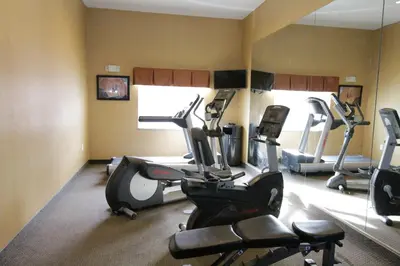 a gym with treadmills and ellipticals in a room at Holiday Inn Express and Suites Montgomery by IHG in Montgomery