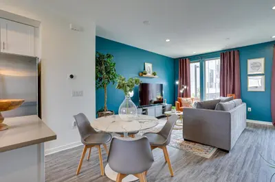 a living room with a table and chairs and a couch at 3 Mi to Center City Philadelphia Townhome in Philadelphia