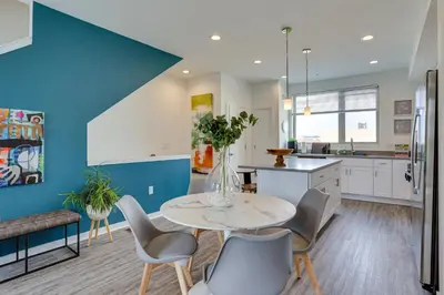 a kitchen and dining room with a table and chairs at 3 Mi to Center City Philadelphia Townhome in Philadelphia