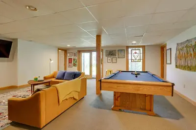 a living room with a pool table and a couch at Less Than 1 Mi to Camelback Resort Home with Pool Table! in Tannersville