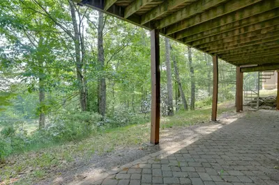 a pavilion with a brick walkway in the woods at Less Than 1 Mi to Camelback Resort Home with Pool Table! in Tannersville
