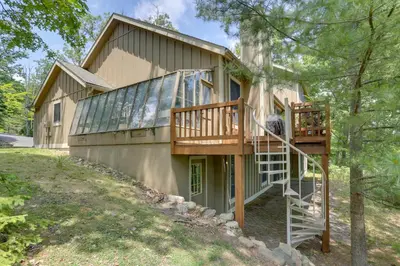a house with a staircase leading up to a balcony at Less Than 1 Mi to Camelback Resort Home with Pool Table! in Tannersville