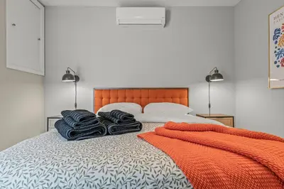 a bedroom with a bed with two towels on it at Stay Rafa At 259 in Philadelphia