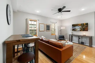 a living room with a couch and a table at Stay Rafa At 259 in Philadelphia