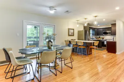 a kitchen and dining room with a table and chairs at Sauna, Fire Pit Spacious and Serene Poconos Getaway in Canadensis