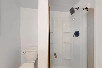 a bathroom with a shower and a toilet at Heaven on Lake Harmony in Lake Harmony