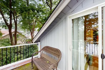 a bench sitting on a porch next to a sliding glass door at Heaven on Lake Harmony in Lake Harmony