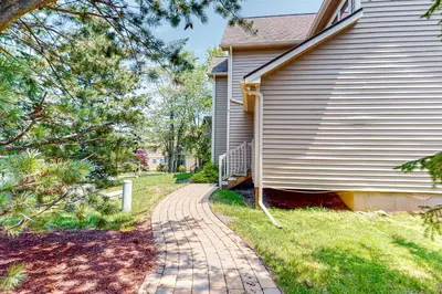 a brick walkway next to a house at Maple Manor in Tannersville