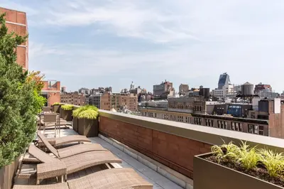a view of the city from the rooftop of a building at Chelsea 1BR w Roof deck Gym Doorman NYC-122 in New York