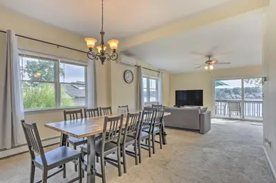 a dining room with a table and chairs at Spacious Lakefront House With a Private Dock in Hopatcong