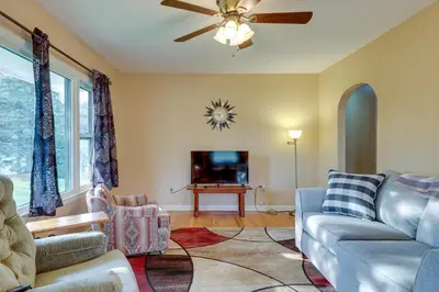a living room with a couch and a tv at Quaint Horseheads Home about 9 Mi to Elmira College in Horseheads